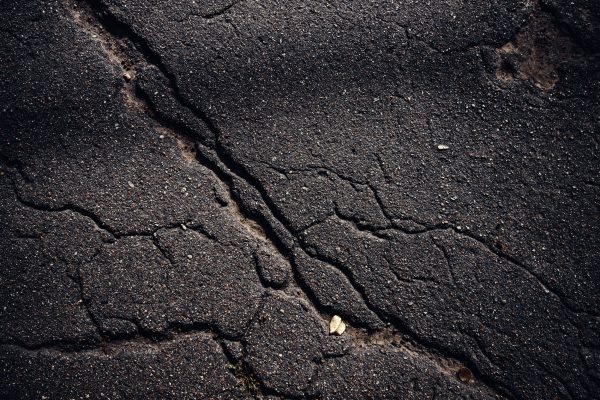 A closeup shot of a textured asphalt background