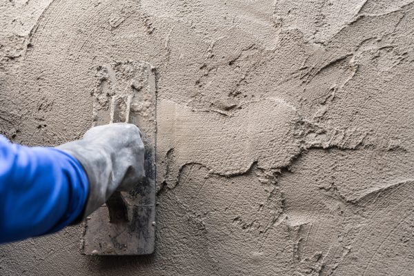 hand-plasterer-plastering-cement-wall-background-2025-01-09-08-18-06-utc